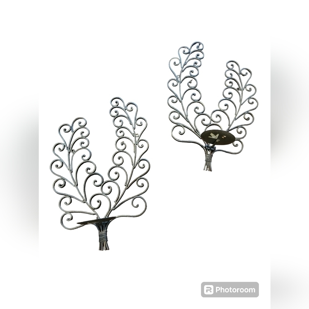 A set of wire candle scones wall hanging.